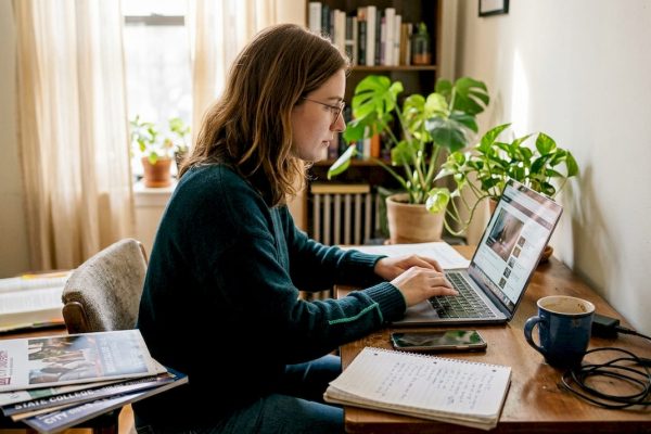 Student studying at home desk for online UK degree